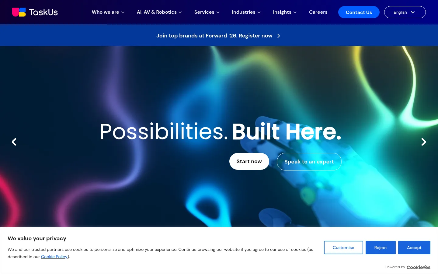 TaskUs website, showing the home page banner headline Possibilities. Built Here. with a cookie notice