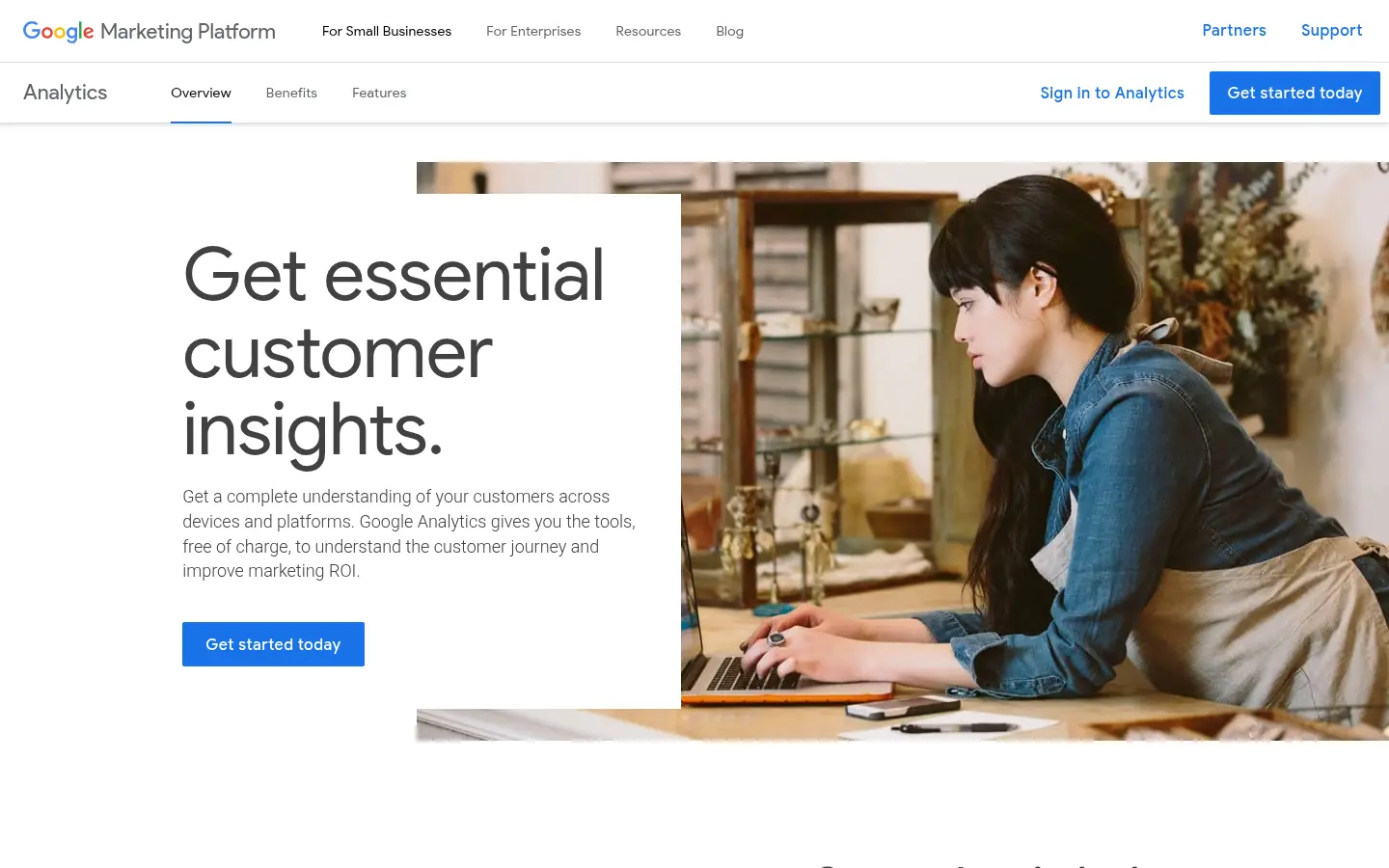 Google Analytics website, showing the headline Get essential customer insights beside a photo of a person at a laptop