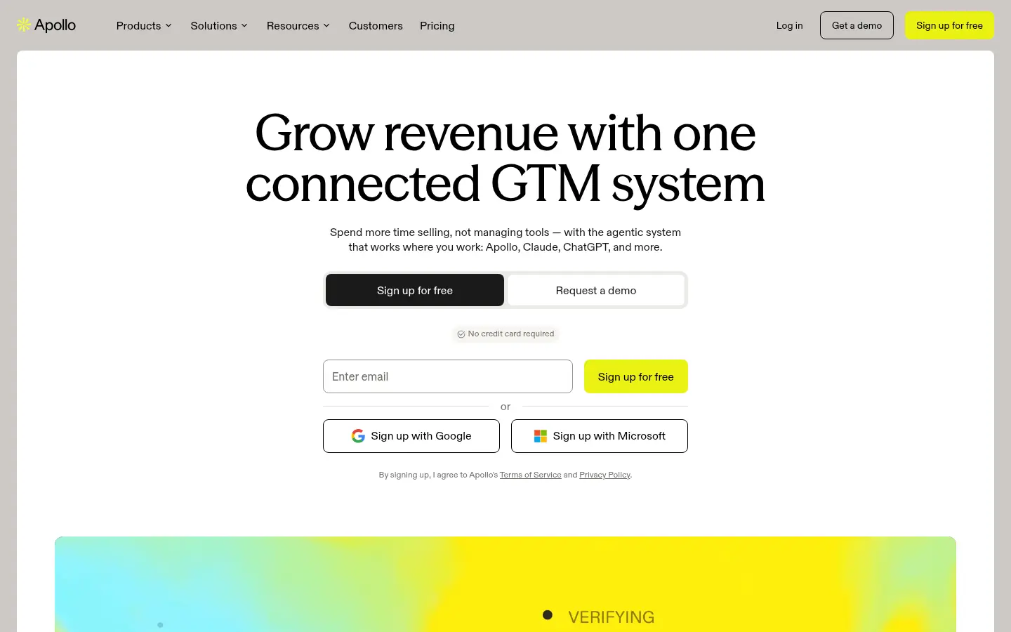 Apollo.io website, showing the headline Grow revenue with one connected GTM system above sign up options