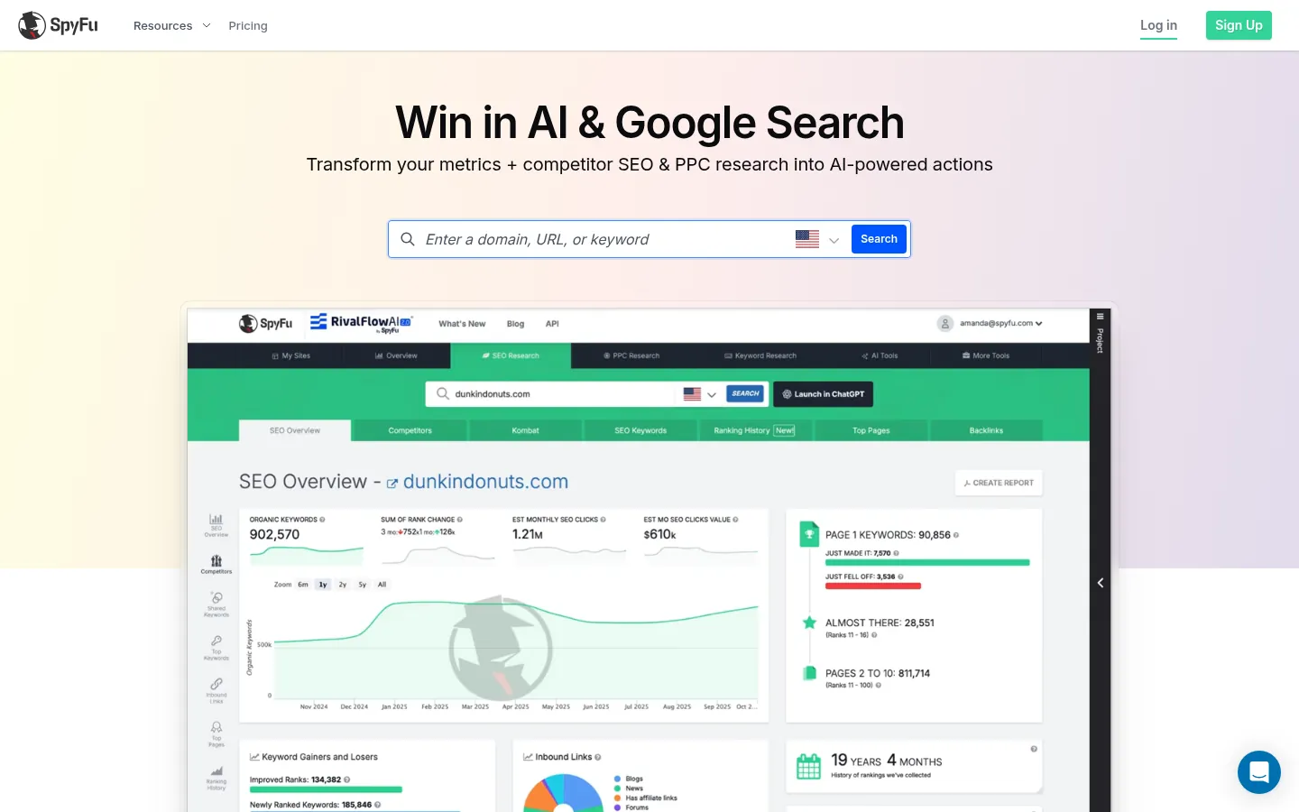 SpyFu website, showing the home page with a domain search box above an SEO overview report