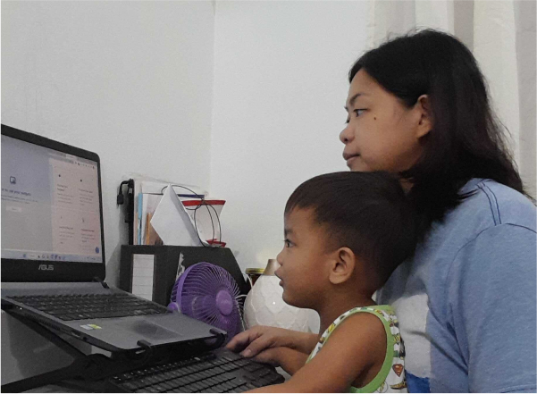 building-bonds-mother-son-using-laptop