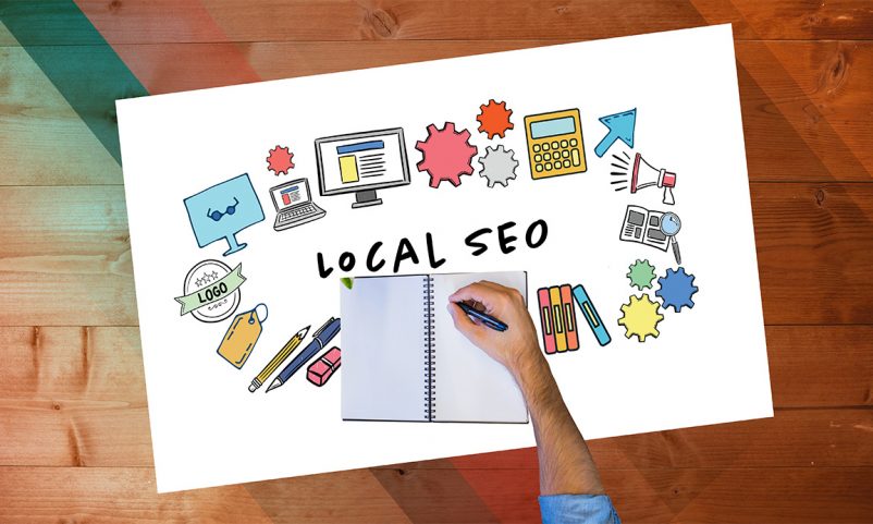 local SEO text surrounded by icons and hands writing