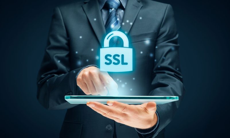 man in a suit clicking in the screen while a lock with SSL written on it appears