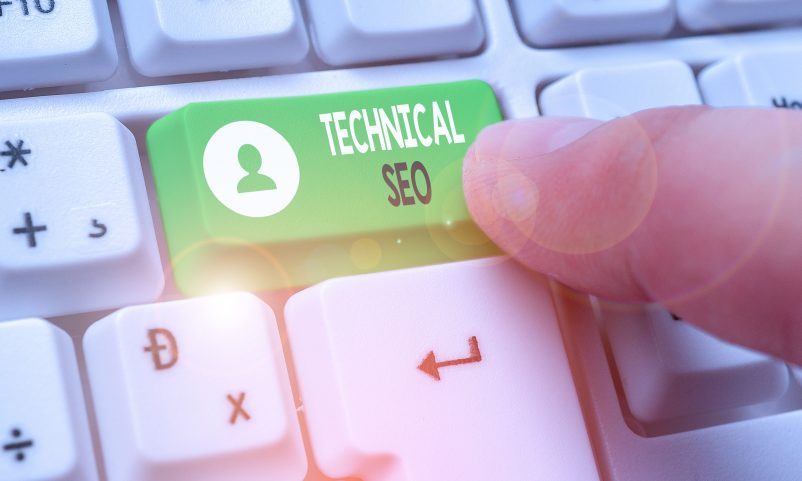 finger pressing a key with “technical seo” on the keyboard